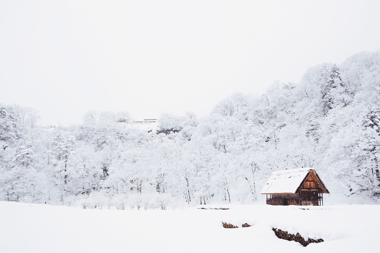 Mountain Cabin covered in snow for Conscious by Chloé