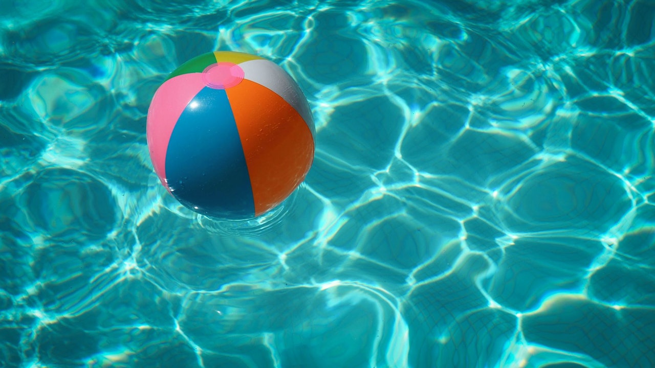 ball floating in swimming pool summer for Conscious by Chloé